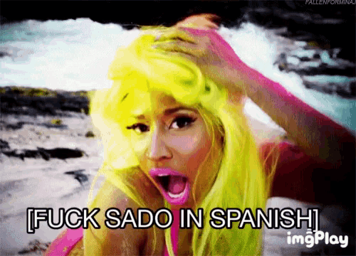 a woman with bright yellow hair says fuck sado in spanish imgplay