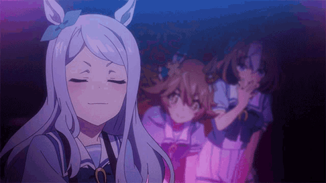 a group of anime girls are standing in a dark room with one girl making a funny face
