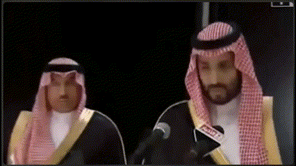 a man in a traditional costume is talking into a microphone with the word arabia on it