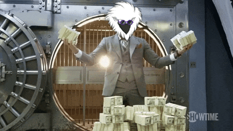 a man in a suit is holding stacks of money in front of a vault door that says showtime