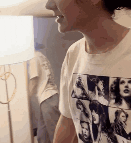 a woman wearing a white t-shirt with a picture of a woman on it