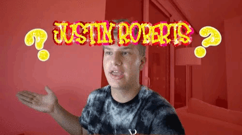 a man stands in front of a red background with the words justin roberts