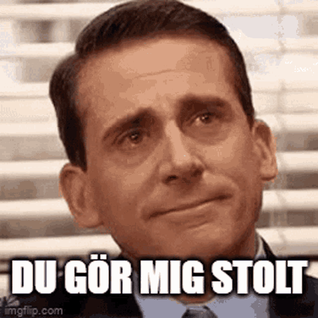 a man in a suit and tie is making a funny face with the words `` du gor mig stolt '' written below him .