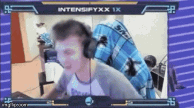 a man wearing headphones is sitting in front of a computer screen with the name intensifyxx 1x on the top