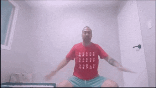 a man in a red shirt with numbers on it