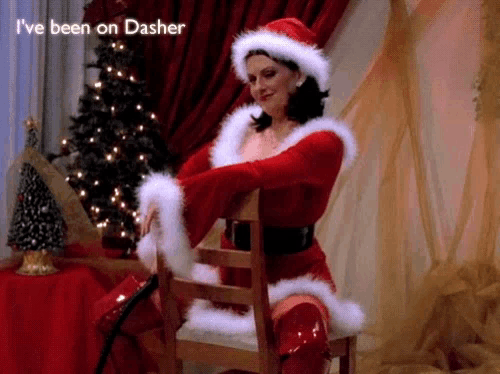 a woman in a santa outfit is sitting on a chair with the words i 've been on dasher above her