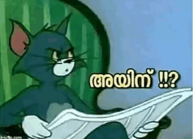 a cartoon of tom and jerry reading a newspaper in malayalam .