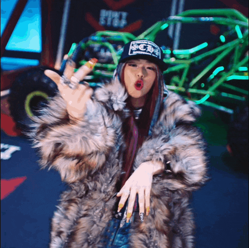a woman wearing a fur coat and a hat that says ' scb ' on it