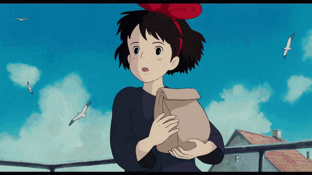 a girl with a red bow on her head holds a bag