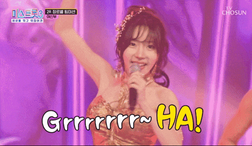 a woman in a red dress singing into a microphone with the words " grrrrrrr ha " written below her