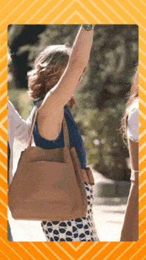 a woman wearing a watch and a tan purse
