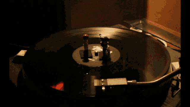 a record is being played on a turntable with two cartridges on it