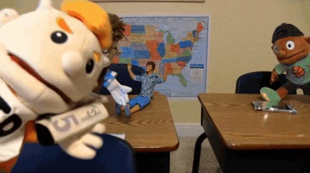 a stuffed animal holding a newspaper that says u.s.a.