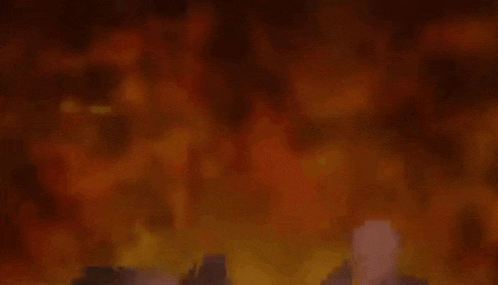 a bunch of feathers are flying in the air on a dark background .