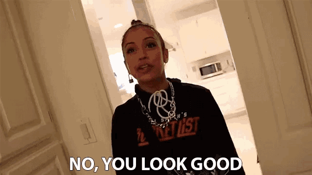 a woman wearing a black hoodie that says ' i 'm a artist ' on it
