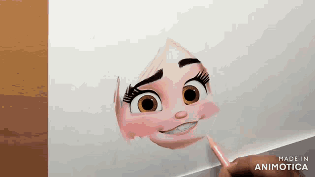 a person is drawing a cartoon character with a pink pencil on a piece of paper .