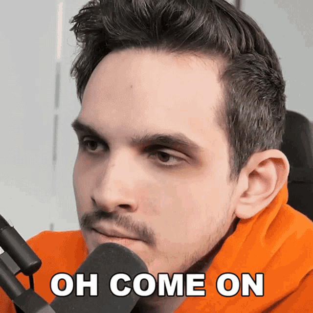 a close up of a man 's face with the words " oh come on " above him