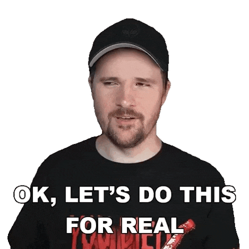 a man with a beard is wearing a black shirt that says ok , let 's do this for real .