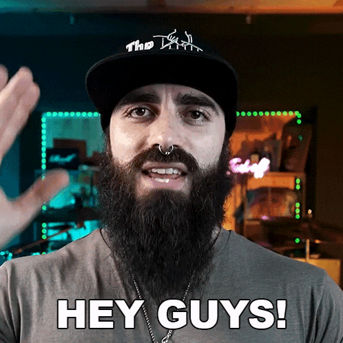 a man with a beard wearing a hat that says hey guys
