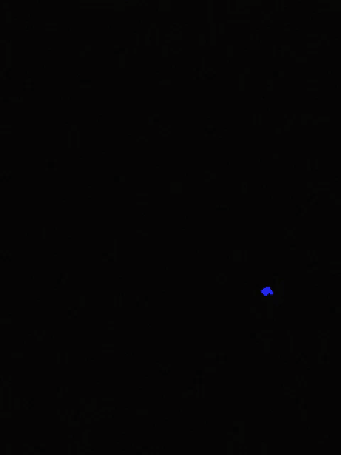 a blue light is shining in the dark on a black background .