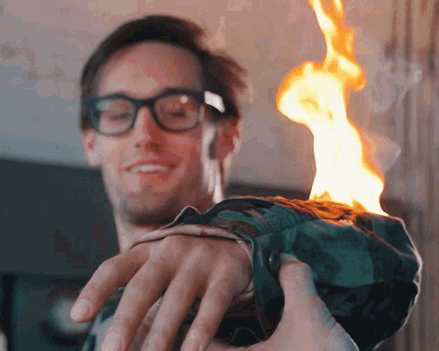 On Fire Fire Proof Suit GIF - On Fire Fire Proof Suit Amazed GIFs