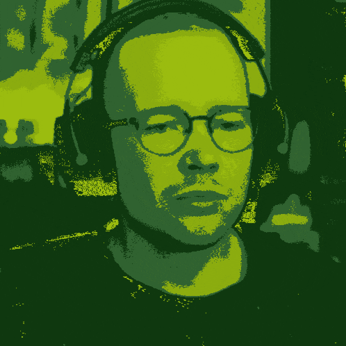 a man wearing glasses and headphones has his mouth wide open