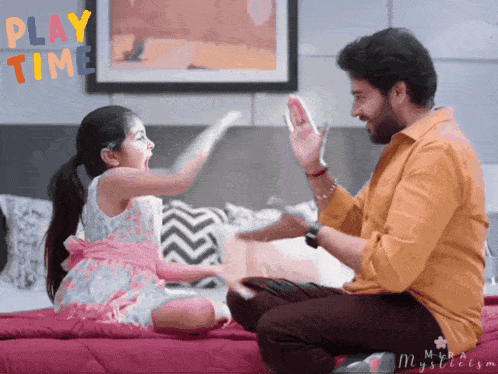 a man and a little girl are sitting on a bed with the words play time written on the wall behind them