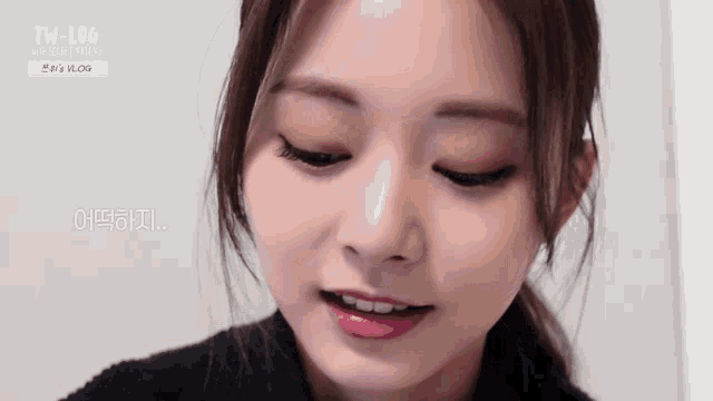 a close up of a woman 's face with her eyes closed