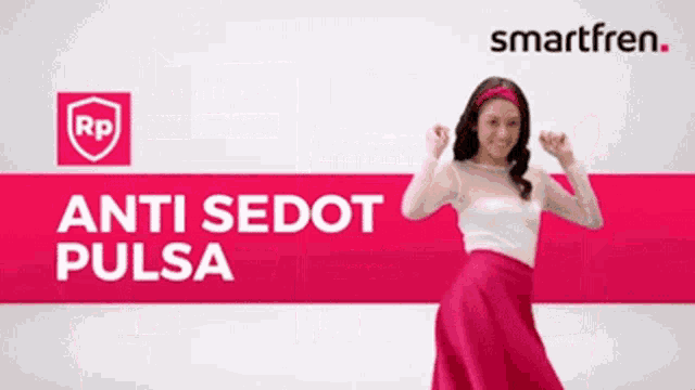 a woman in a pink skirt is dancing in front of a smartfren sign