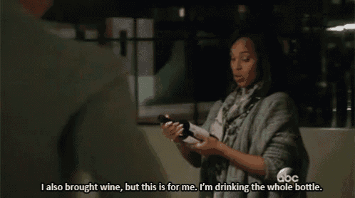 a woman is holding a bottle of wine and says i also brought wine but this is for me