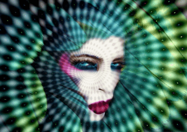 a woman 's face is surrounded by a circular pattern of dots