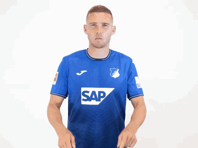 a man in a blue shirt with the word sap on the front