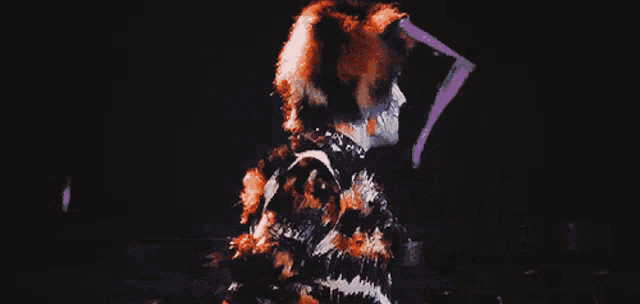 a person dressed as a cat with a striped shirt