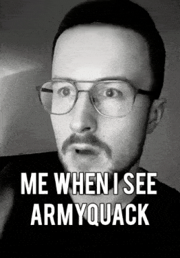 a man with glasses and a mustache says " me when i see army quack "