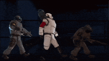 a group of soldiers are standing in the snow holding guns