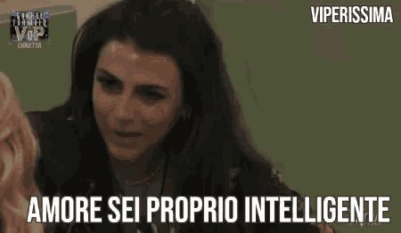 a woman is wearing headphones and smiling with the words `` amore sei proprio intelligente '' .