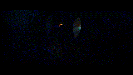 a man in a suit and tie is standing in the dark