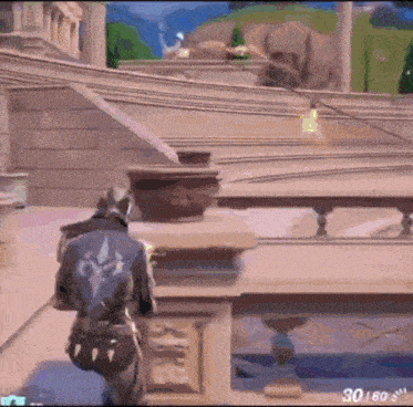 a man is standing on top of a building in a video game while holding a gun .
