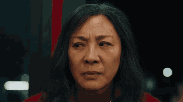a close up of a woman 's face with long hair