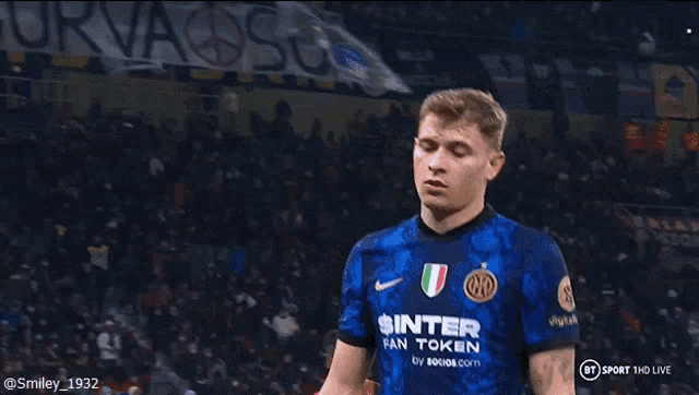 a soccer player wearing a jersey that says " inter " on it