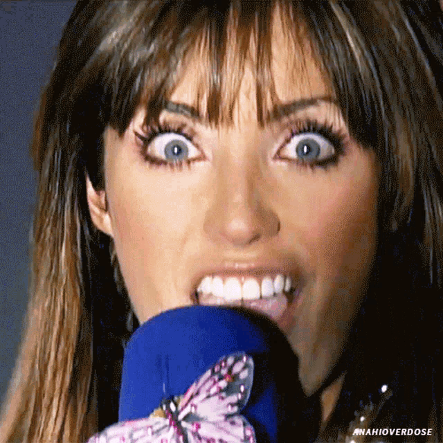 a close up of a woman 's face with the hashtag #mafiaverdose on the bottom