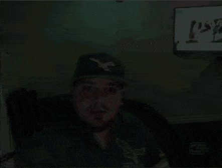 a man wearing a green eagles shirt and hat