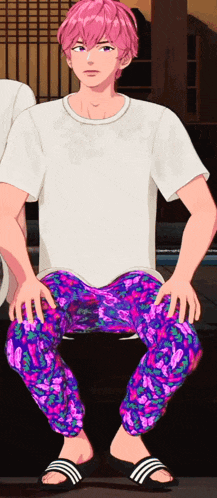 a man with pink hair is wearing a white shirt and pink pants