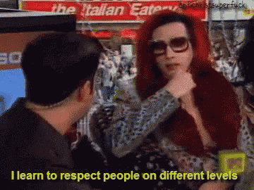 a man and woman are talking in front of a sign that says italian eatery