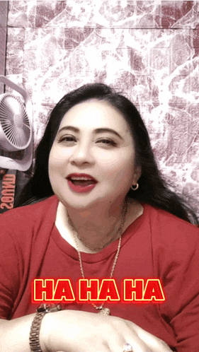 a woman in a red shirt is laughing with the text ha ha ha on her face