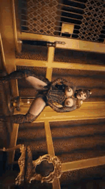 a woman in a leopard print costume is standing in a room with a gold staircase .