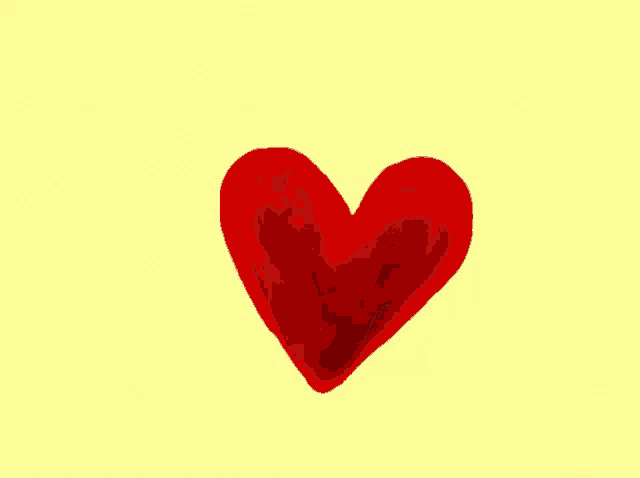 a red heart on a yellow background with a white border