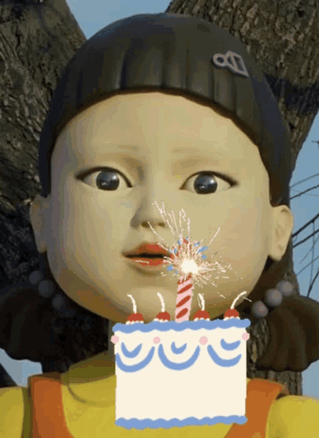 a doll blowing out a candle on a cake