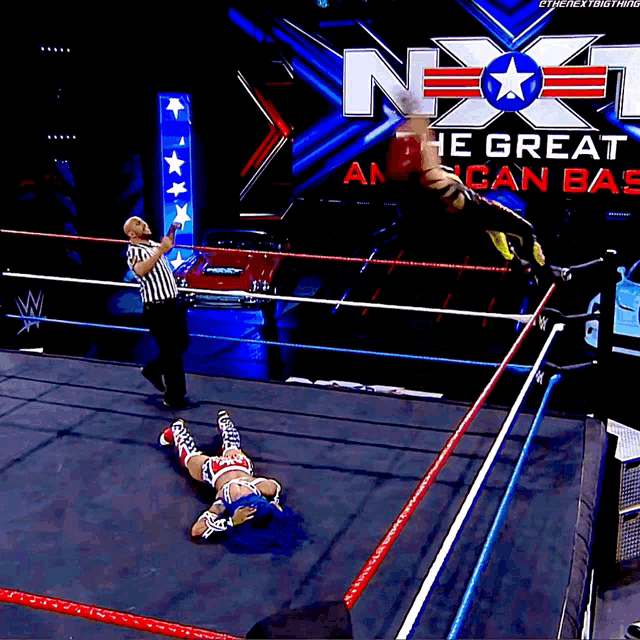 a female wrestler in a ring with a sign that says " the great american bash "