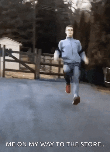 a man is running down a road with the words me on my way to the store